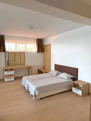 a bedroom with a large bed in a room at Byala sea view apartment Studio in Byala