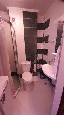 a bathroom with a toilet and a sink at 2 Room Apartment Gallery with Poolview in Sunny Beach