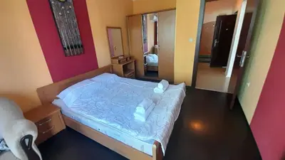 a bedroom with a bed and a mirror in it at 2 Room Apartment Gallery with Poolview in Sunny Beach