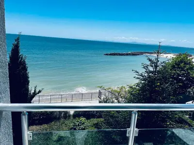 a view of the beach from a balcony at Blue Bay House in Nesebar