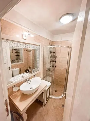 a bathroom with a sink and a shower at Monte Carlo Vaio - 1BR Garden Apt - With Direct Pool Access in Sunny Beach
