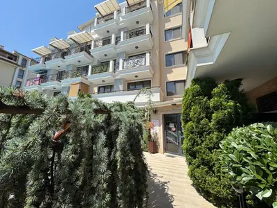 a building with a bunch of plants in front of it at VP Villa Valencia in Sunny Beach