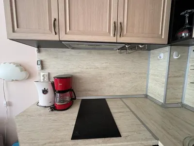 a kitchen counter with a coffee maker on it at VP Villa Valencia in Sunny Beach