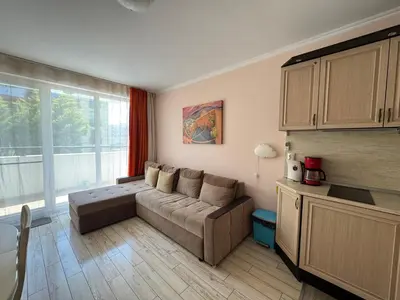 a living room with a couch and a large window at VP Villa Valencia in Sunny Beach