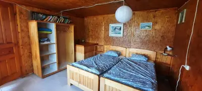 a bedroom with a bed and a book shelf at Къща за гости тип Бунгало Арапя, Царево in Tsarevo