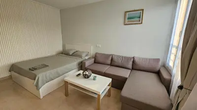 a small room with a bed and a couch at Studio Vanita in Sozopol