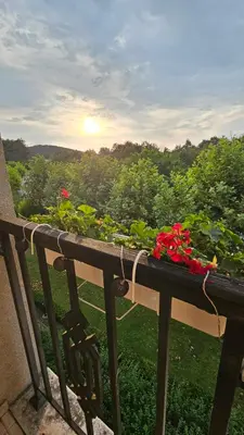 a balcony with a flower planter on a railing at Studio Vanita in Sozopol