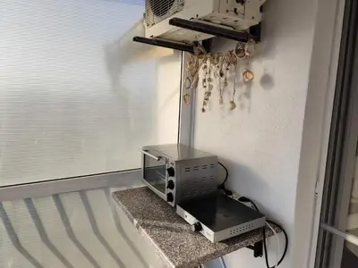 a toaster oven sitting on a counter next to a window at Studio Juli in Lozenets