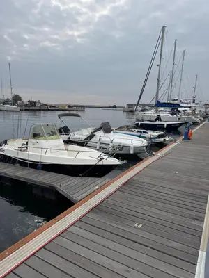 a group of boats are docked at a dock at Windmill Nessebar studio with sea view in Nesebar