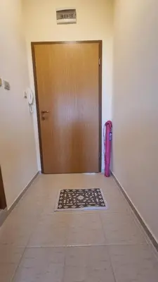 a door with a mat in the middle of a hallway at Studio in Relax Complex, Sveti Vlas in Sunny Beach