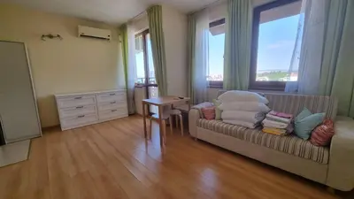 a living room with a couch and a table at Studio in Relax Complex, Sveti Vlas in Sunny Beach