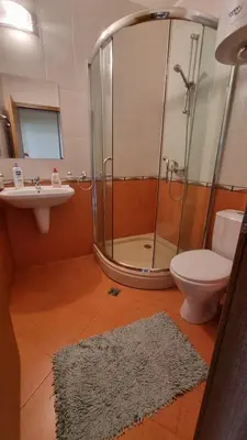 a bathroom with a shower and a toilet and a sink at Studio in Relax Complex, Sveti Vlas in Sunny Beach