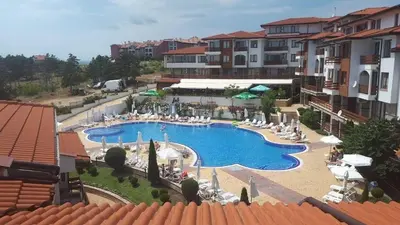 an overhead view of a swimming pool in a resort at Gardenia Hills Studio in Sunny Beach
