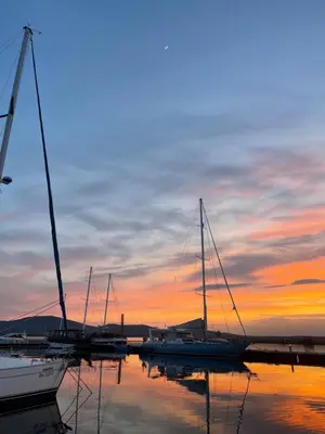 a group of boats docked in a marina at sunset at Amarena Studio Santa Marina, Sozopol in Sozopol