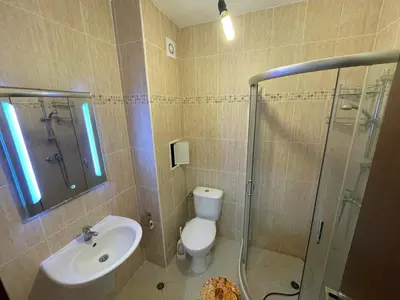 a bathroom with a toilet and a sink and a shower at Sun and Sea A22 in Sunny Beach