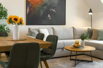a living room with a couch and a table at INCANTO Residence in Varna City