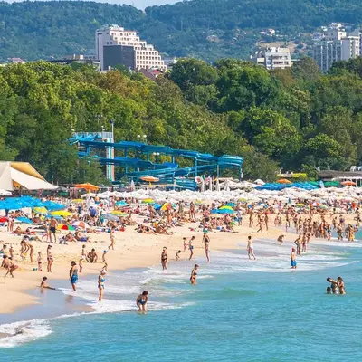 a large group of people on a beach at INCANTO Residence in Varna City