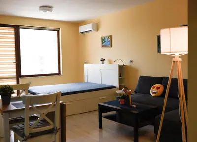 a small room with a bed and a couch at Sandy Dreams Cozy Studio in Pomorie