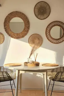 a table with two baskets on a wall with mirrors at The Boho House with Free Parking in Nesebar