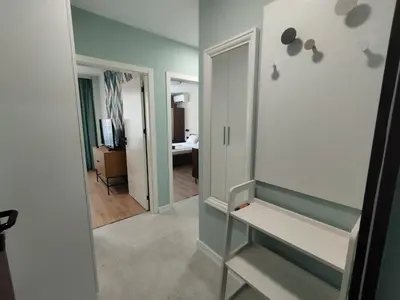 a dressing room with a mirror and a hallway at RadiSun with Free Parking space in Burgas City