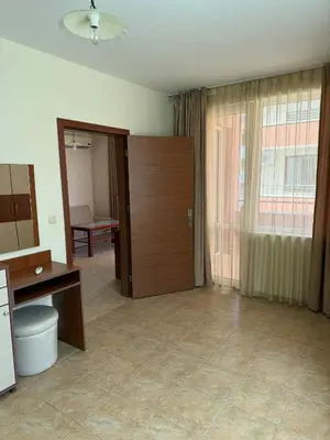 a living room with a large door and a room with at Ravda14 in Ravda