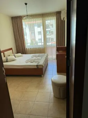 a bedroom with a bed and a toilet in it at Ravda14 in Ravda