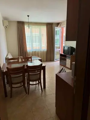 a kitchen and dining room with a table and chairs at Ravda14 in Ravda