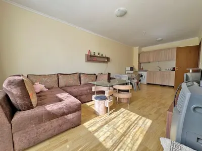 a living room with a couch and a table at 2 rooms Astoria 2 Elenite in Sveti Vlas