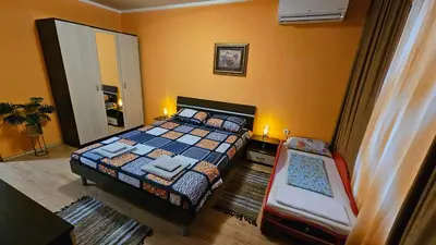 a bedroom with a bed and a chair in it at Apartment 15 Sea Grace in Sunny Beach