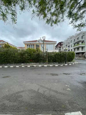 a parking lot in front of a building at Villa Maria in Sveti Vlas