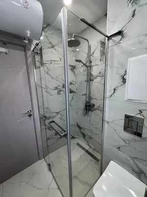 a bathroom with a glass shower with a toilet at On the beach 7 in Sozopol