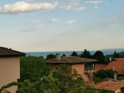 a view of roofs of houses in a town at Affordable Rooms with BBQ 5 min drive from beach Villa Lusi in Varna City