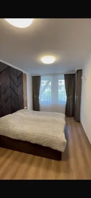 a bedroom with a large bed and a window at Etara 4 Sweti Wlas Apart Complex in Sveti Vlas
