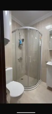 a bathroom with a shower with a toilet and a sink at Etara 4 Sweti Wlas Apart Complex in Sveti Vlas