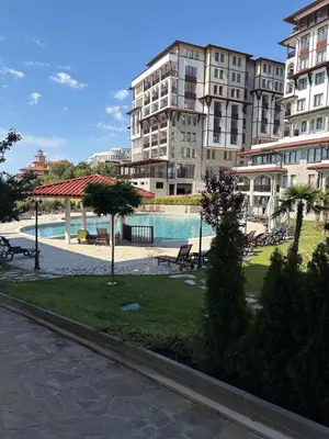 a large apartment complex with a swimming pool in a city at Etara 4 Sweti Wlas Apart Complex in Sveti Vlas