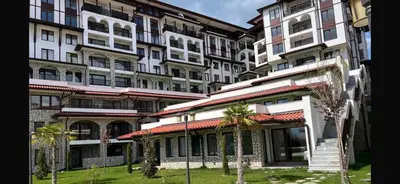 a group of tall buildings with palm trees in front at Etara 4 Sweti Wlas Apart Complex in Sveti Vlas