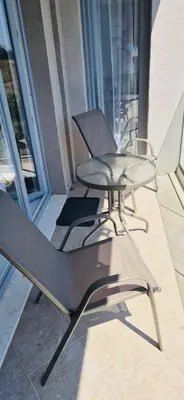 two chairs and a table on a balcony at JADORE DUNE Apartment 9 Sunny Beach in Sunny Beach