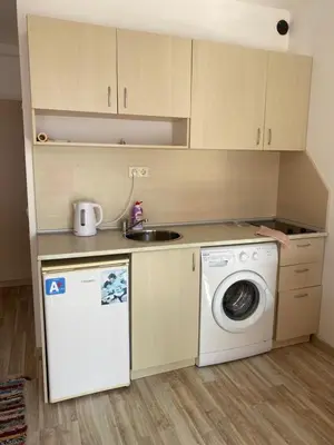 a kitchen with a washing machine and a sink at Sunny Byala in Byala