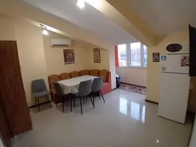 a kitchen and dining room with a table and chairs at Top Floor Two Bedroom Apartment in Central Burgas in Burgas City