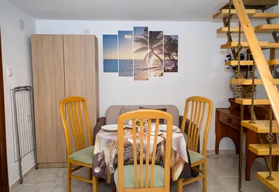 a dining room with a table and chairs at Central Studios on Maria Luiza Street - Cozy Stay in Varna by Flat Mаnаger in Varna City