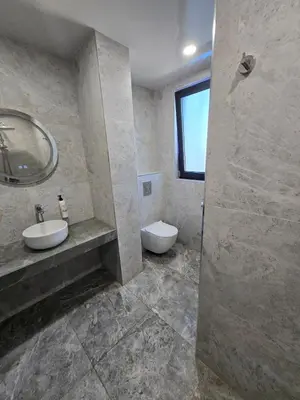 a bathroom with a sink and a toilet and a mirror at Villa Cadaques, private pool with heating and salt water in Lozenets