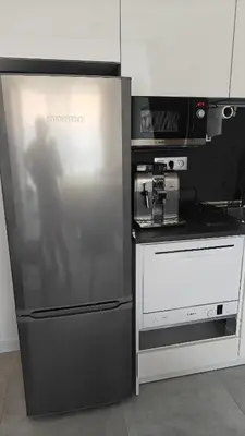 a kitchen with a refrigerator and a microwave at Vivid Sea and City Luxury Studio 2 plus 2 in Burgas City
