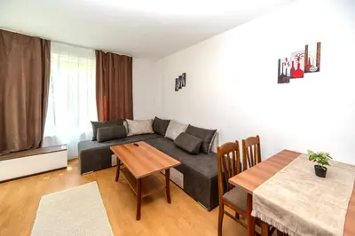 a living room with a couch and a table at Apartment E 12 Yassen HV in Sunny Beach