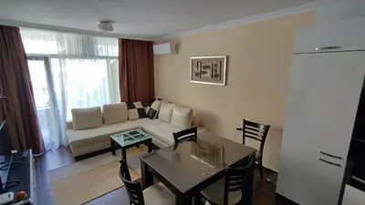 a living room with a couch and a table at Dolche Vita 2, Banana Tree Stay in Sveti Vlas