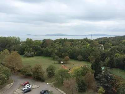 an aerial view of a park with trees and a lake at Hotel Park in Burgas City
