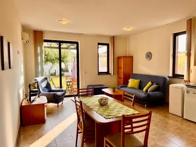 a living room with a couch and a table at Velika Garden Villas 1 bedroom apartment, Lozenets in Lozenets