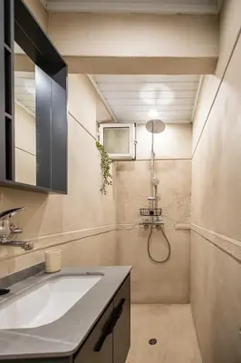 a bathroom with a sink and a shower at City Center Gem Varna - 5 Guests in Varna City