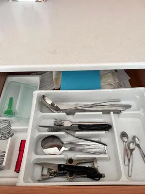 a drawer full of utensils in a container at Трёхкомнатная квартира in Sveti Vlas