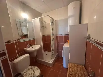 a bathroom with a toilet sink and a shower at Sunny Seasons top view apartment SEA&POOL in Byala