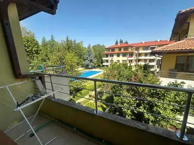 a balcony with a view of a swimming pool at Sunny Seasons top view apartment SEA&POOL in Byala
